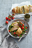 Chicken wrapped in puff pastry on green beans