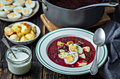 young beetroots soup with potatoes and egg