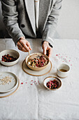 Porridge with pistachios rose petals chia and tahini paste