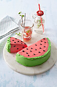 A cake in the shape of a watermelon slice