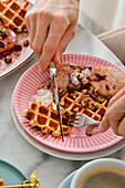 Waffles for breakfast with home-made jam and nuts