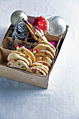 Pistachio biscuits in a box with Christmas decorations