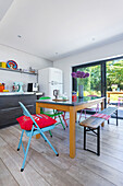 Dining area with various chairs in open kitchen