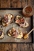 Roast fig tartines with ham and honey