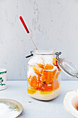 Salted oranges in a hinge top glass jar