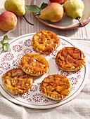 Almond tarts with pears and caramel sauce