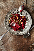 Beetroot risotto with poppy seeds and roasted grapes