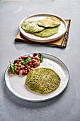 Green spinach pancakes with a bean medley
