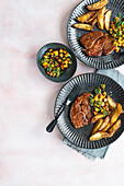Black treacle glazed gammon steaks crisp potato wedges and pineapple chutney