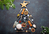 Christmas baking composition made in shape of Christmas fir tree from kitchen tools and cooking ingredients