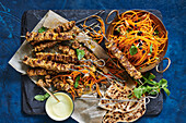 Spiced beef skewers with carrot salad
