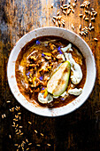Spelt oatmeal with pears and caramel walnuts