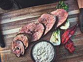 Leg of lamb from the rotisserie with grilled vegetables and tartar sauce