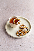 Gingerbread wreath cookies with cup of tea