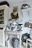 Lavishly decorated console table with vintage-style, shabby-chic decorations