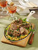 Black Forest mince meat roulades in a noodle and pea nest