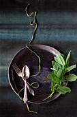 Place setting decorated with a sprig of mint