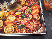 Roasted vegetables on a baking tray for pizza sauce