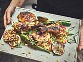 Jerk chicken with chili and lemon slices