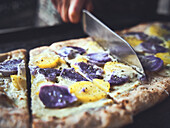 Purple and yellow potato pizza