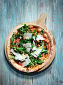 Pizza with rocket and fresh Parmesan cheese
