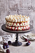 Almond meringue tart with plum compote