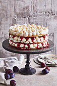 Almond meringue tart with plum compote