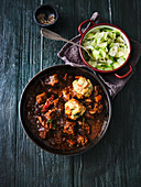 Stout beef goulash with pretzel dumplings and steamed white cabbage