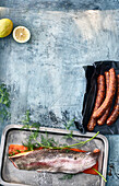 Grilled ingredients - sausages and fish fillet