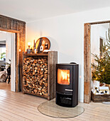 Wood-burning stove with wood in a rustic living room