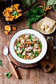 Chicken soup with tortellini and chanterelles