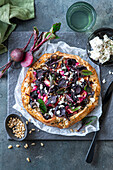 Baby beetroot galette with pine nuts and feta