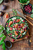 Rocket salad with figs, raspberries and feta cheese