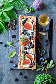 Tarte with coconut cream, figs and blueberries