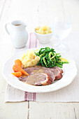 Stuffed roast goose, mash potato, cabbage and carrot