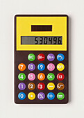 Pocket calculator with colourful buttons