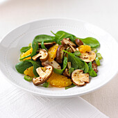 Mixed mushrooms, spinach, and orange salad