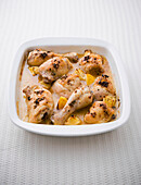 Roast chicken with thyme in tray