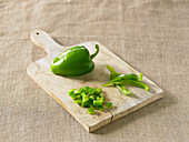 Green pepper on chopping board