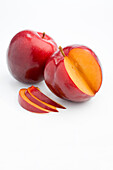 Sliced plum and whole
