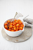 Bowl of glazed carrots and nutmeg