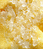 Crystals growing on yellow sponge