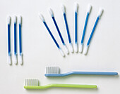 Nine cotton tips and two toothbrushes