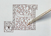 Illuminating a letter by applying gesso