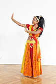 Teenage girl performing Bollywood dance move