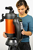 Woman mounting a go-to telescope