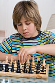 Boy playing chess