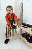 Girl putting on shoes