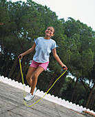 Girl skipping rope