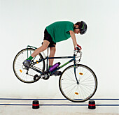 Boy applying the brakes on his bike